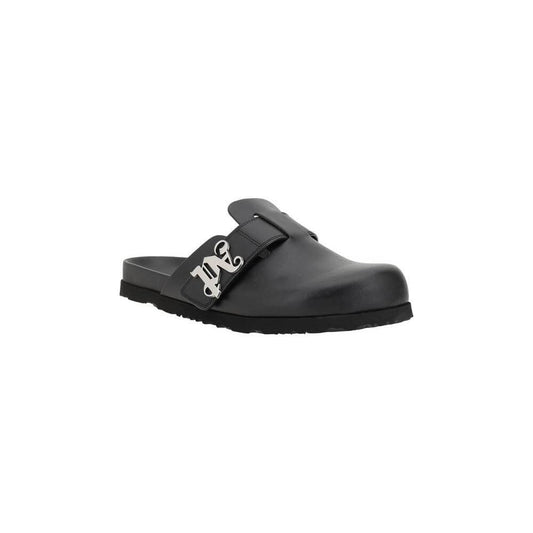 Palm Angels leather mules with round toe, slip-on design, and branded logo plaque on wide strap, offering comfort and modern style.
