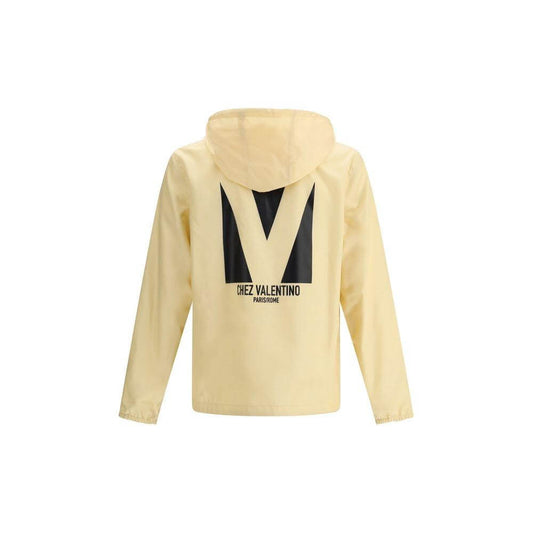 Valentino waterproof jacket with monogram and logo on back, featuring adjustable hood and front zipper closure, perfect for rain protection.