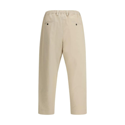 Back view of Marni cropped pants in beige with elastic waistband and slit pockets.