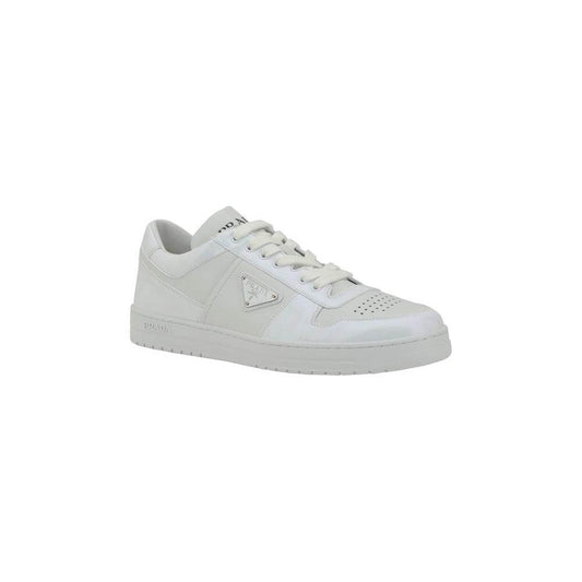 Prada Downtown leather sneakers with lace-up closure and iconic triangular plaque, featuring perforated toe and contrasting heel logo.