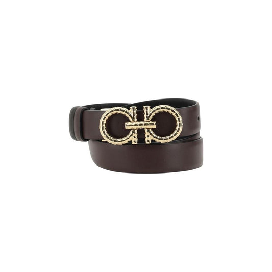 Ferragamo reversible leather belt with iconic Gancini buckle, showcasing luxury and versatility with a double-sided design.
