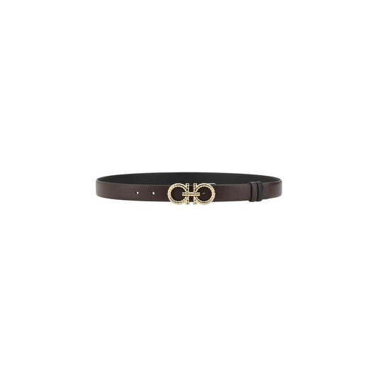 Ferragamo reversible leather belt with iconic Gancini buckle, showcasing luxury and versatility in elegant monochrome and bold design.