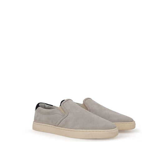Brunello Cucinelli gray suede slip-on sneakers with white rubber soles and black back detail featuring gold 'Solomei' print.