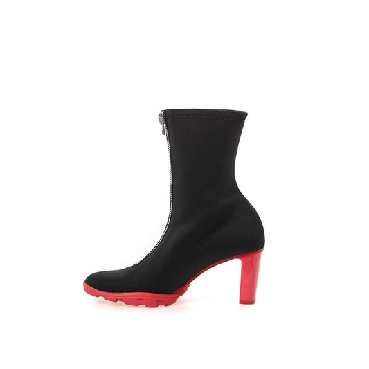Alexander McQueen black neoprene boot with red heel, side view showing zip fastening and rubber sole.