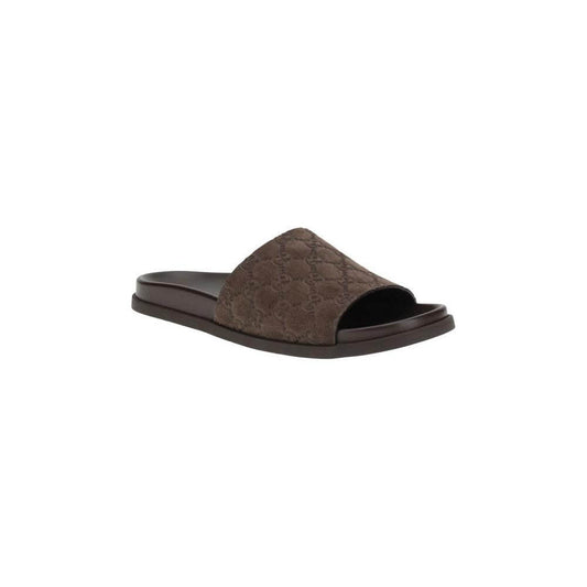 Gucci slider sandals with GG motif and suede upper, featuring a contoured sole for comfort and style. Ideal for elegant summer wear.