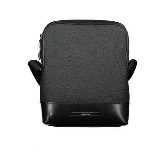 Calvin Klein sleek black shoulder bag with contrasting details and adjustable strap, featuring external and internal pockets for practical use.