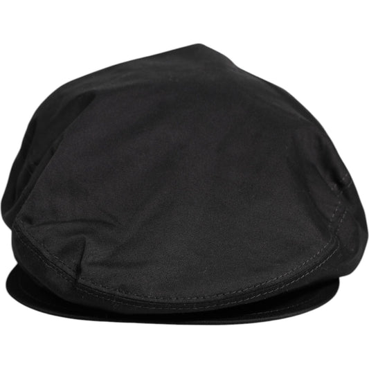 Dolce & Gabbana black cotton newsboy cap with logo details, crafted in Italy, showcasing style and elegance.