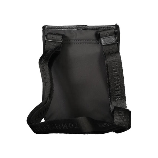 Tommy Hilfiger black polyester men's shoulder bag with adjustable strap and logo detailing, rear view.