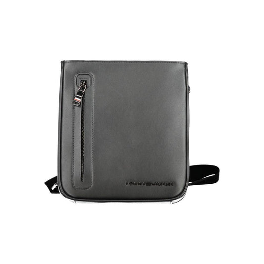 Tommy Hilfiger black polyethylene shoulder bag with adjustable strap, external and internal pockets, and zip closure with logo.