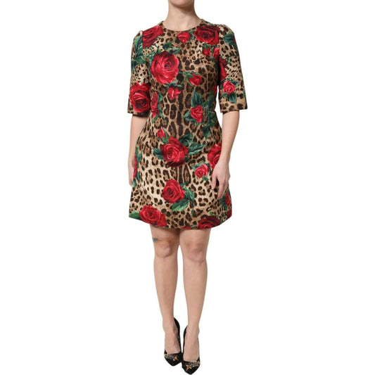 Dolce & Gabbana brown leopard print mini dress with red roses, short sleeves, A-line style, zip closure, made of cotton, silk, and viscose.