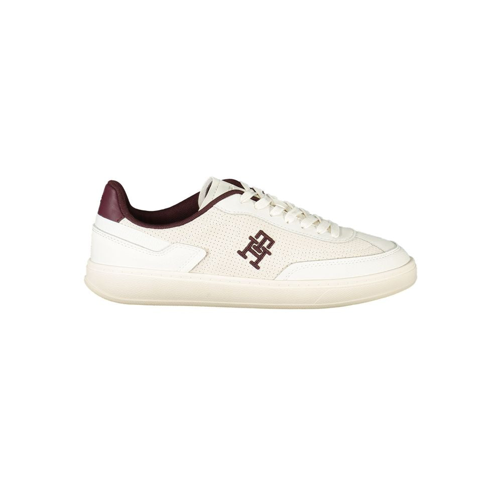 Tommy Hilfiger Beige Leather Women Sneaker with brown accents and iconic embroidery logo, perfect blend of style and comfort.