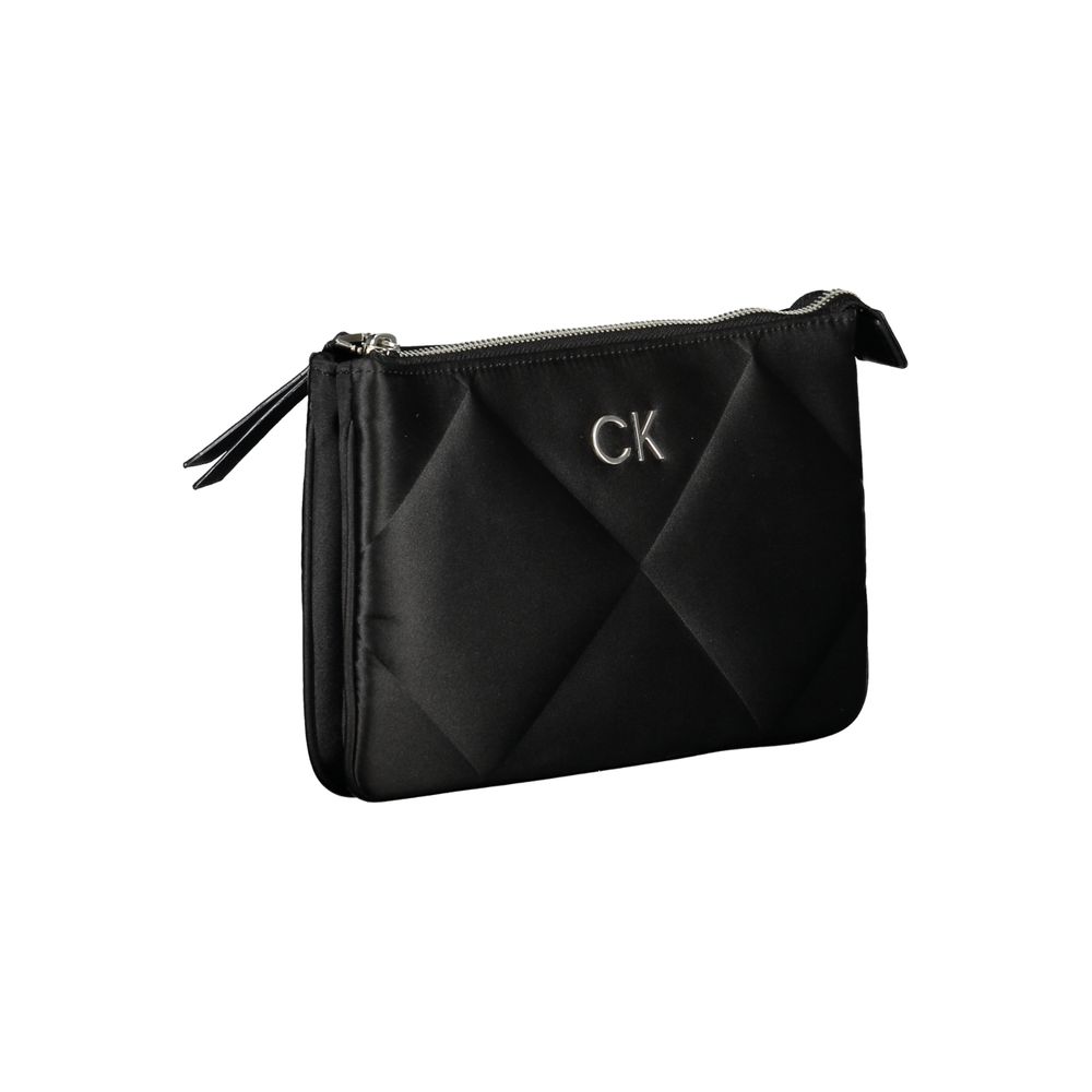 Calvin Klein Black Polyester Handbag with adjustable shoulder strap, two compartments, internal card pocket, and zip closure.