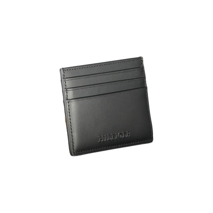 Tommy Hilfiger Black Leather Wallet with card holder, central pocket and logo, featuring contrast details and spaces for cards.