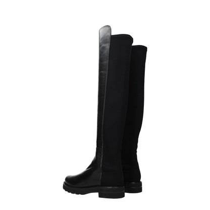 Stuart Weitzman Black Leather Over The Knee boots with aged effect, rubber sole, and mid heels, side profile view