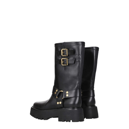 Black leather ankle boots with gold buckle details and rubber sole, designed for a casual style with mid heels and vintage effect.