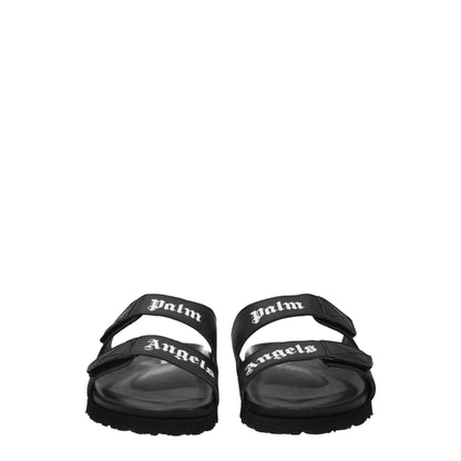 Palm Angels Black Leather Slippers with front logo, open toe, and rubber sole. Casual style with strap closure and low flat heel.