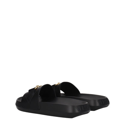 Versace Black Leather Slippers with gold front detail, open toe, flat rubber sole. MPN 1011304DV46G1B00V. Casual style footwear.