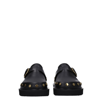 Isabel Marant Black Leather Slippers with gold studs and buckle closure, featuring a vintage style and low flat heel, front view.