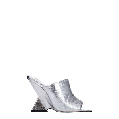 The Attico Gray Leather Platform Sandals with a high heel and open toe, featuring a vintage effect in silver leather, side view.