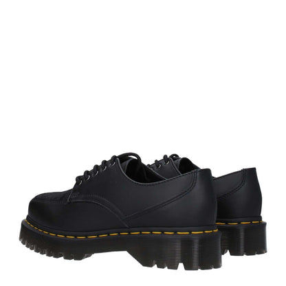 Dr. Martens Black Leather Oxfords And Derbies with lace-up design and mid heels, featuring a square toe and rubber sole.