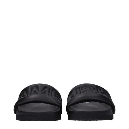 Front view of Ambush Black Leather Slippers with logo, street style, open toe design, leather upper, and rubber sole.