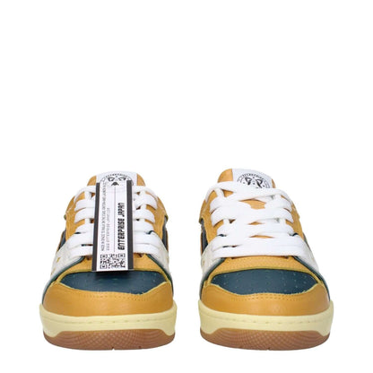 Front view of Enterprise Japan Green Leather Low Top Sneakers with round toe and lace-up design, featuring mustard details and rubber sole.