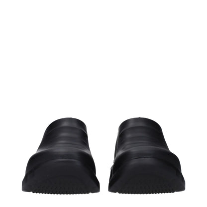 Front view of Givenchy Black Cotton Slippers with rubber sole and round toe, showcasing side and back logo, casual style with wedge heel.