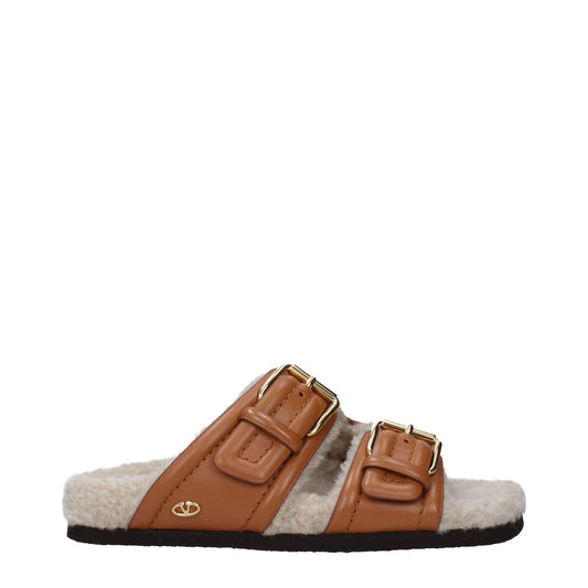 Valentino Garavani Brown Leather Slippers with buckle closure, rubber sole, open toe, and flat heel. Casual style. MPN: S0IZ4SQPZT6.