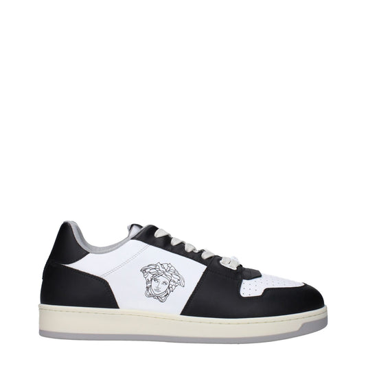 Versace White Leather Low Top Sneakers with front and back logo detailing, designed in white leather with black accents.