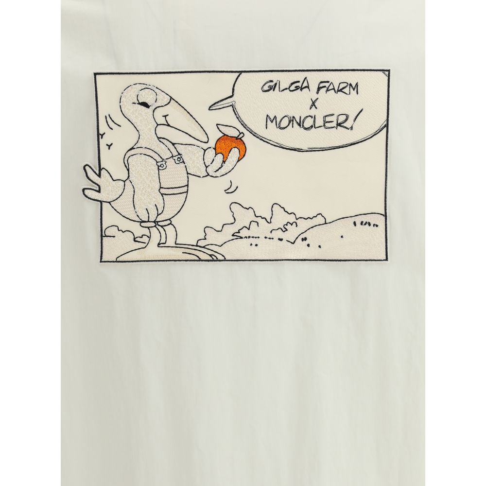 Moncler x Donald Glover White Cotton Coat comic-style patch with Gilga Farm x Moncler design featuring embroidered mascot holding an orange.