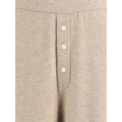 Front detail of Guest in Residence Beige Cashmere Casual Pants with buttons, showcasing luxury and style.