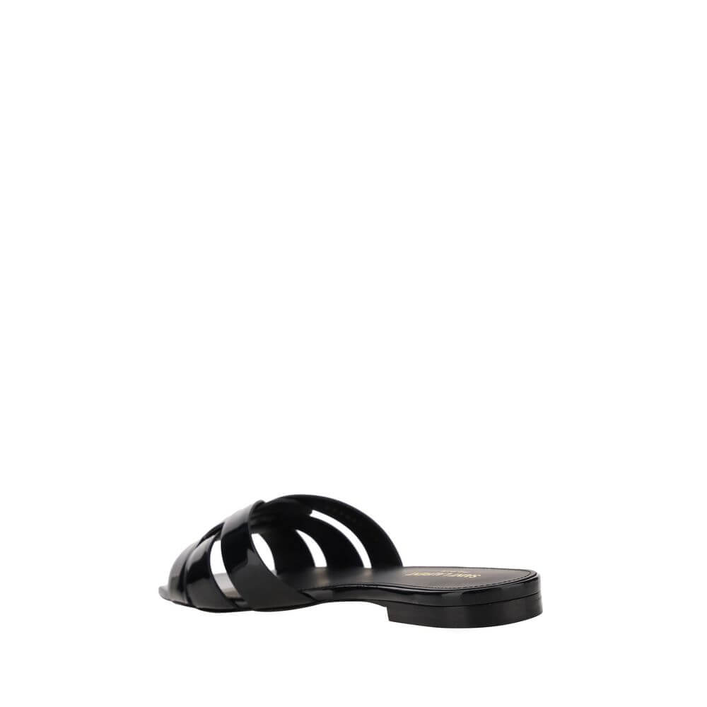 Saint Laurent Black Calf Leather Bos Taurus Flat Sandals with a square toe and woven front design, displayed on a minimalist background.