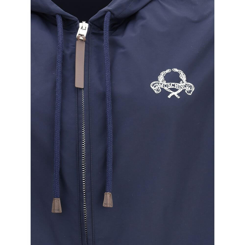 Moschino Blue Polyester Shell Jacket with hood and zipper, featuring stitched logo on front. Stylish waterproof design for urban wear.