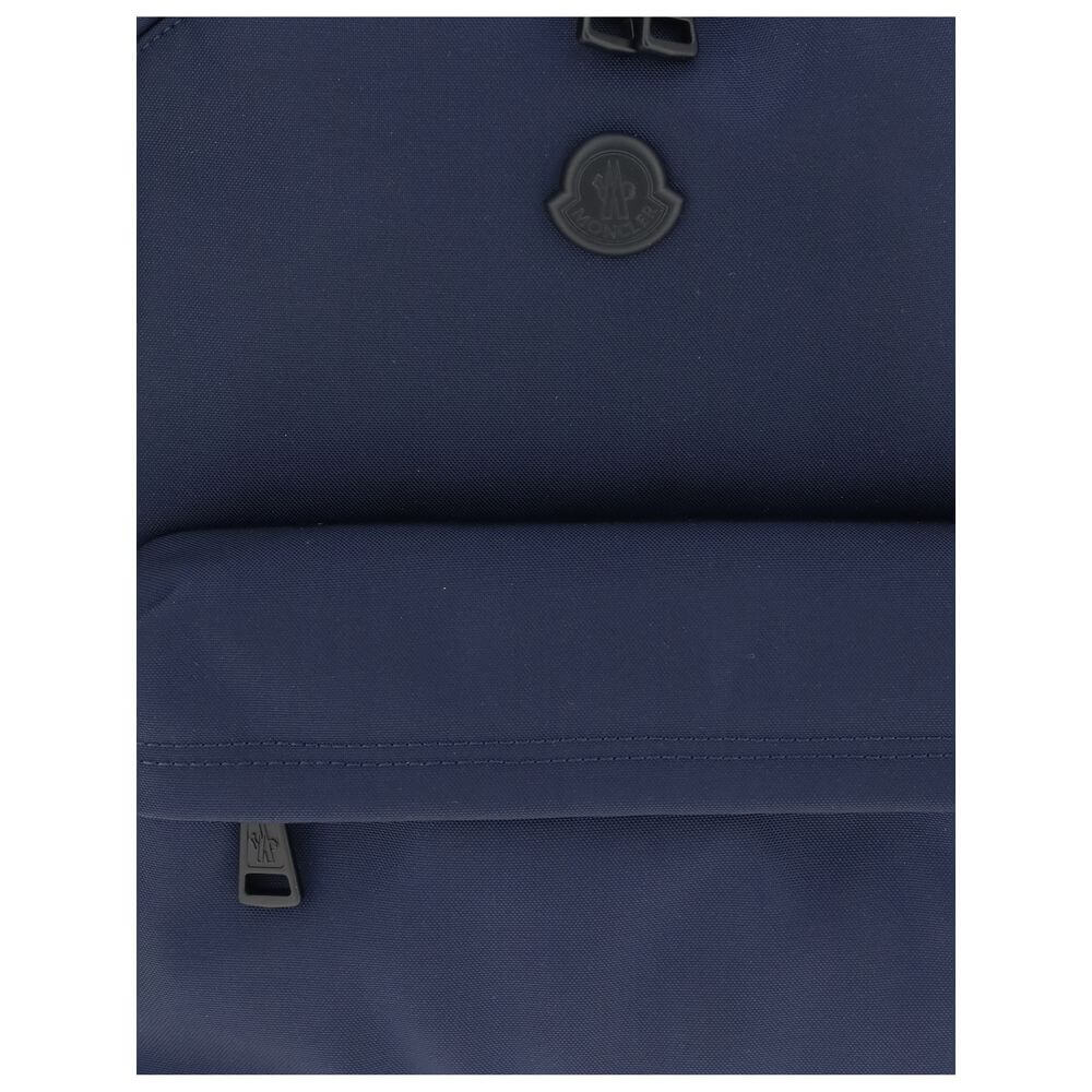 Moncler Blue Nylon Backpack showcasing water-repellent fabric with zipper closure and elegant leather trim.