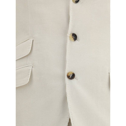 Close-up of Brunello Cucinelli Cream Cotton Two-Piece Suit blazer showing button details and pocket design.