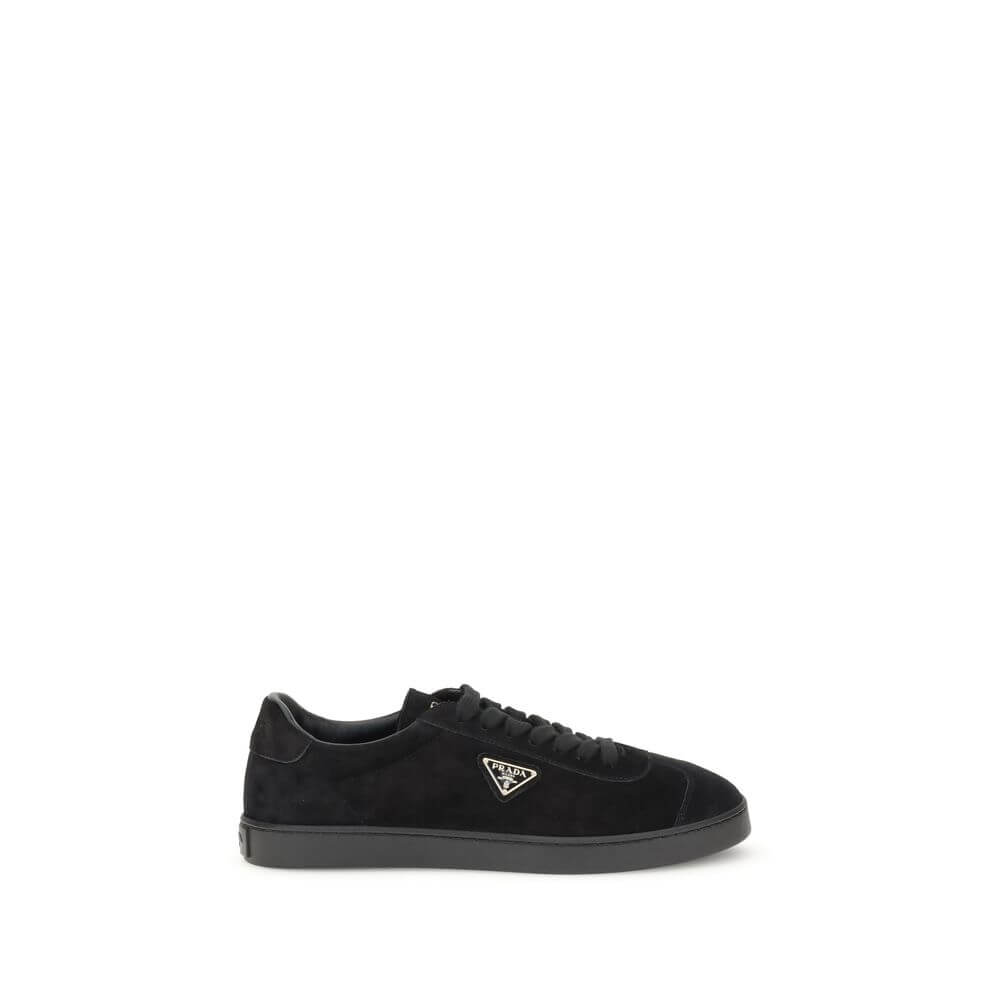 Prada Black Calf Leather Bos Taurus Low Top Sneakers with triangular plaque and logo, flat rubber sole, made in Italy.