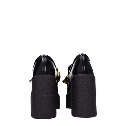 Rear view of Stella McCartney Black Leather Platform Loafers with high heels and rubber sole.