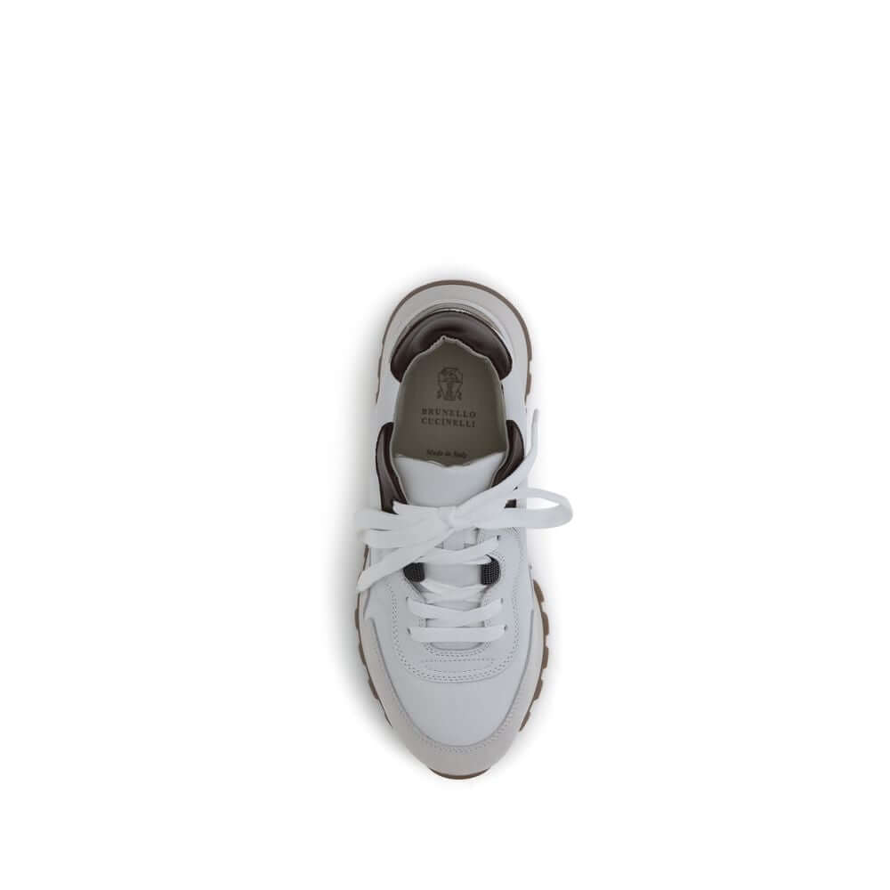 Brunello Cucinelli White Leather Athletic Sneakers top view with shiny jewel detail and flat cotton laces.