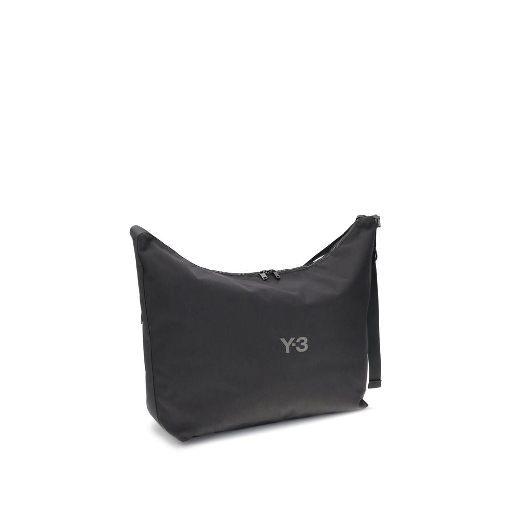 Y-3 Black Polyamide Shoulder Bag with logo, featuring adjustable strap, large compartment, and zippered closure for contemporary style.
