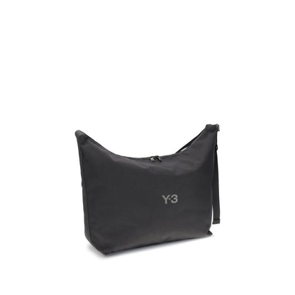 Y-3 Black Polyamide Shoulder Bag with logo, featuring adjustable strap, large compartment, and zippered closure for contemporary style.