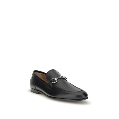 Gucci Black Calf Leather Bos Taurus Slip-On Loafers with metallic Morsetto detail, round toe, elegant silhouette, Spring style.