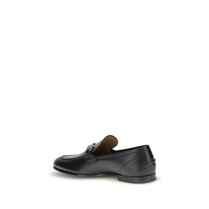 Gucci Black Calf Leather Bos Taurus Slip-On Loafers with Morsetto detail, elegant round toe, embossed logo, formal or casual shoe.