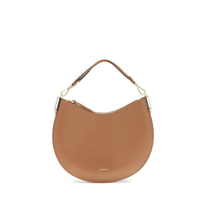 Coccinelle Beige Calf Leather Bos Taurus Shoulder Bag with detachable strap and zip closure.