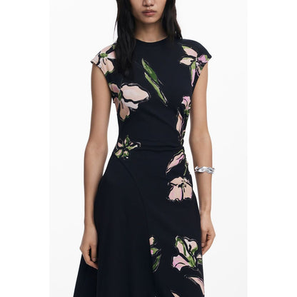 Woman wearing Desigual Black Cotton Women Dress with floral print.