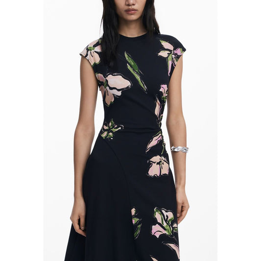 Woman wearing Desigual Black Cotton Women Dress with floral print.