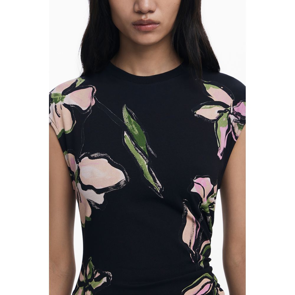 Model wearing Desigual Black Cotton Women Dress with floral design and short sleeves, showcasing bold style and elegant fit.