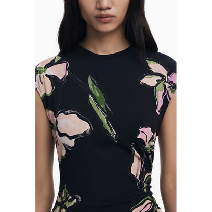 Model wearing Desigual Black Cotton Women Dress with floral design and short sleeves, showcasing bold style and elegant fit.