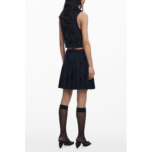Back view of model wearing Desigual Black Polyester Women Skirt with unique flock design and side zipper detail.