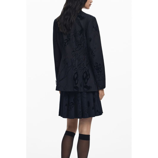 Back view of woman wearing Desigual Black Polyester Women Jacket showcasing floral pattern and chic style.