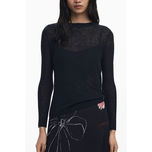 Model wearing a Desigual Black Polyester Women Dress with long sleeves and artistic accents
